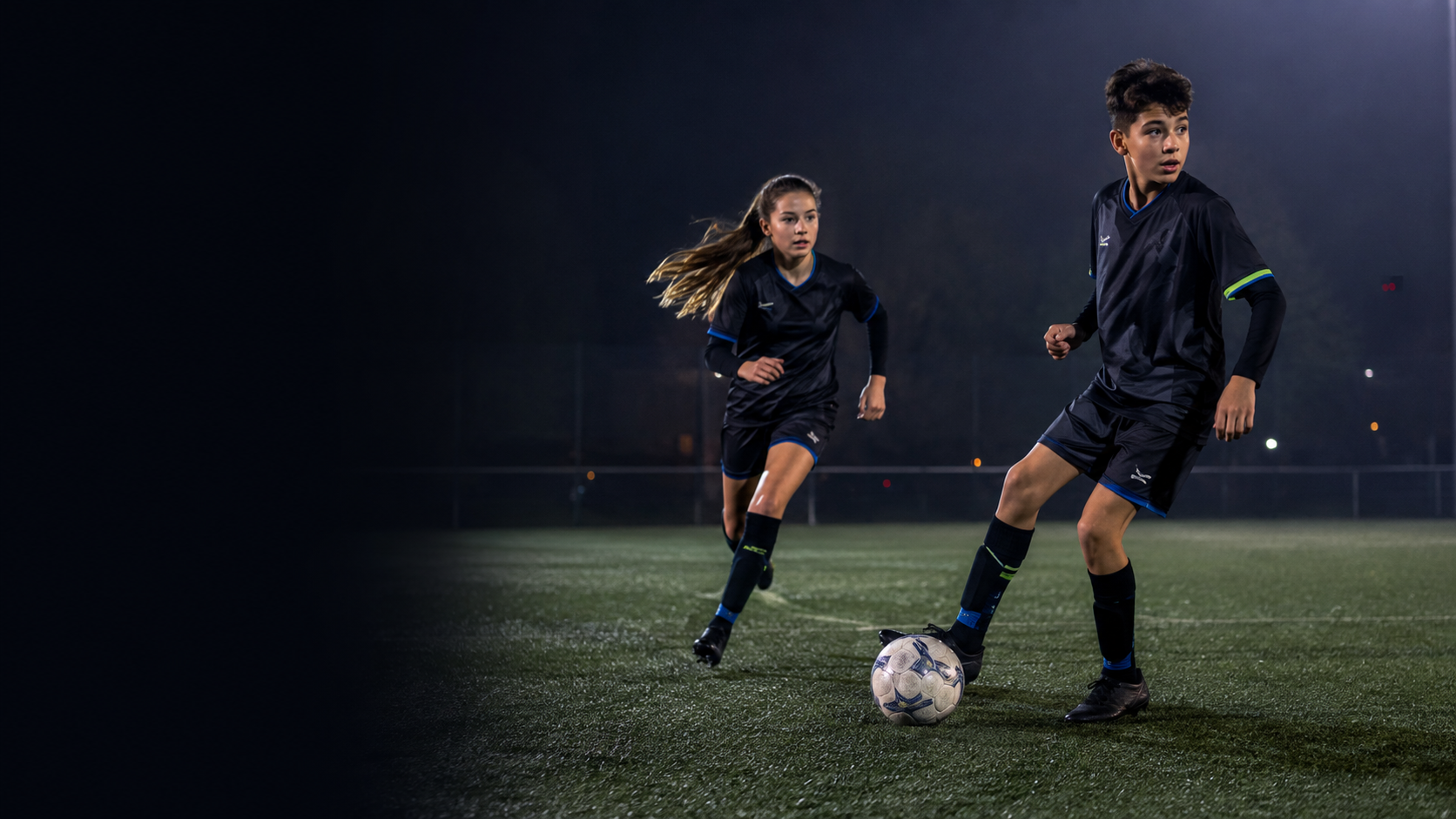 A boy and girl applying their individual focus in a match